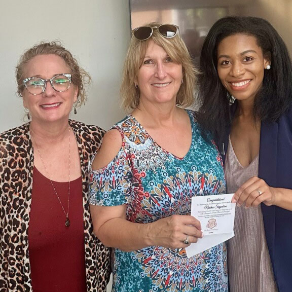 Winner of the one-Night Staycation Door Prize at the Beaumont House B&B was Sheila Lewis. L to R: DNA Board Member Elizabeth Greer, Sheila Lewis, and DNA Exec. Director Leah Hunter